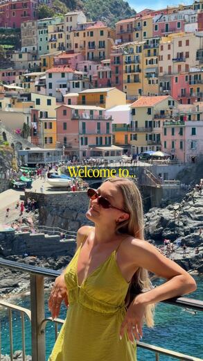 Riomaggiore seen from the water in Cinque Terre, Italy